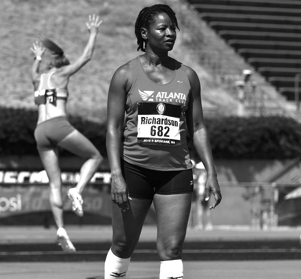 W50 Regina Richardson of Clayton, North Carolina, eyes the high jump bar as a rival warms up.