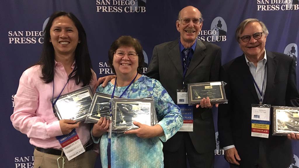 Chris and Ken (center) showed off their hardware (woodenware) at Press Club awards.