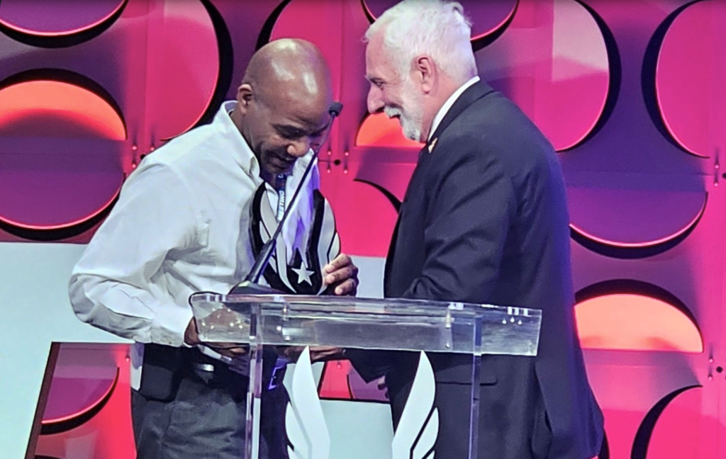 In 2023, Robert Thomas received the President's Award from USATF prez Vin Lannana at the annual meeting.