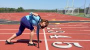 Diane plays with a cane at start of a workout as she makes comeback from knee surgery.