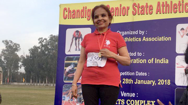 Opinder Sekhon stood on a medal podium after winning gold at the January 2018 Chandigarh Masters Association meet.