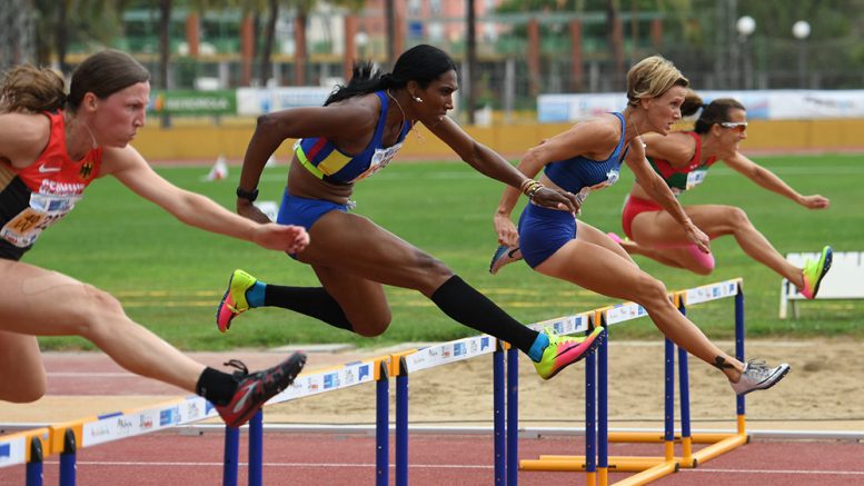 Yanelle (in long black socks) had the height advantage in Malaga but not speed, although she overcame another hurdler at end