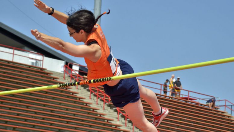 Becca flies over bar