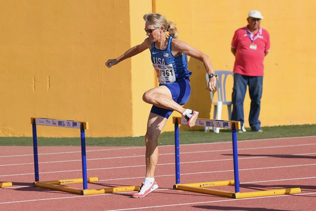Tina Bowman (photographer not listed) took silver in the W65 long hurdles at Malaga worlds.