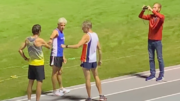 Dan King gets good-luck fist-bumps at start of Saturday's mile record attempt in Columbia, South Carolina.